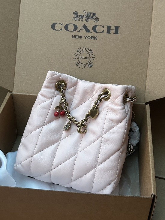 Coach Handbags - Coach Light Pink Quilted Leather Mini Bucket Bag With Cherry Charm